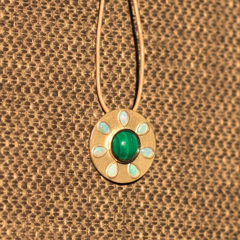 Malachite Pendant + Opals on a golden textured background - Conges Life